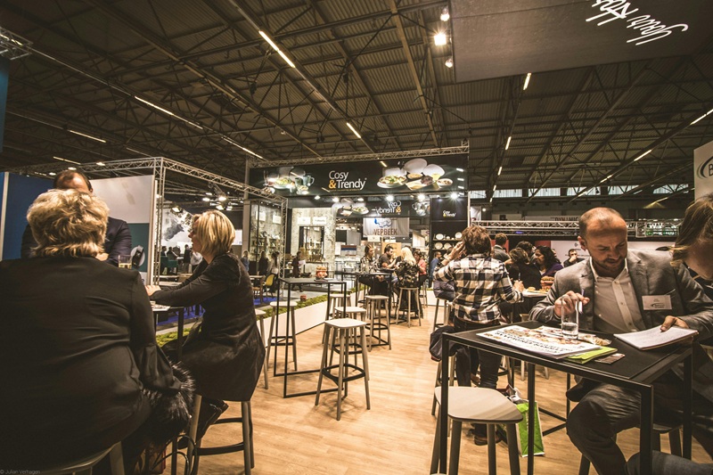 A group of tech professionals networking at a conference, engaging in discussions and exchanging ideas.
