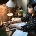 A programmer preparing for coding interview questions with coding tools and strategies.