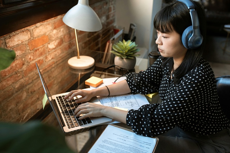 A programmer preparing for coding interview questions with coding tools and strategies.