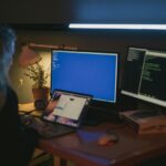 Person coding on laptop with icons of code, learning, and progress around, symbolizing daily improvement in programming skills