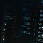 Close-up view of colorful HTML and CSS code displayed on a dark computer screen, representing web development and programming work.